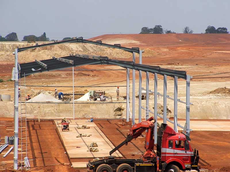 Steel structure at a waste disposal site with one raised central bay