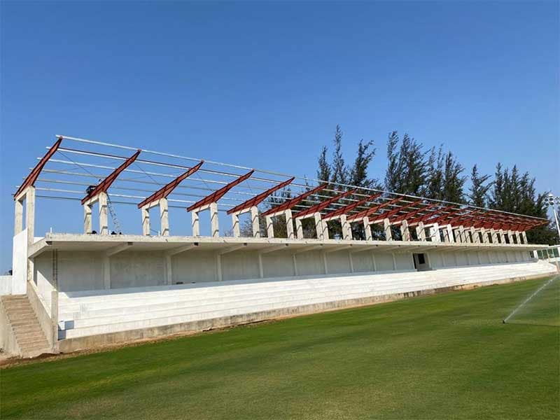 Steel roof covering erected over an existing football stand in Mozambique