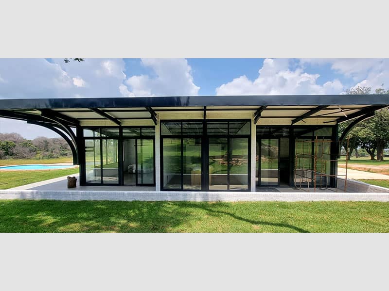 Steel-frame house central communal living area under roof